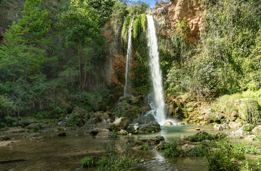 A stunning waterfall surrounded by lush greenery in Anna, Valencia.